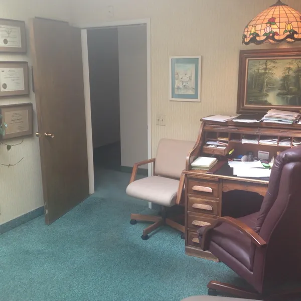 A psychologist's office with a roll-top desk in Suite B at 2564 State Street, Carlsbad, under the suite's previous tenant