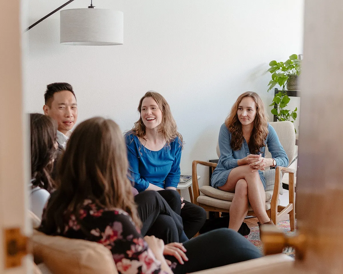 Coastal Therapy Group clinicians in conversation; the same doctoral-level team sees clients online across California