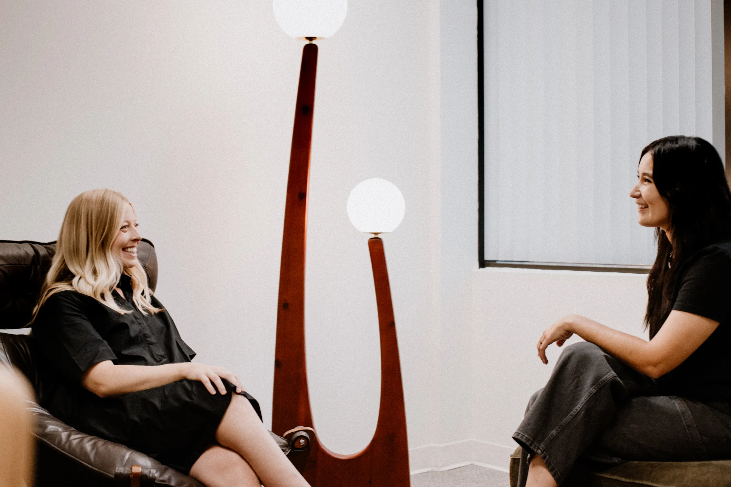 Two Coastal Therapy Group psychologists in conversation about a psychological evaluation